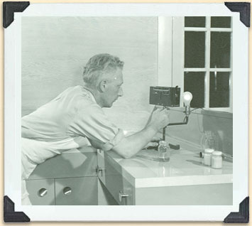 Using a honey classifier, Tisdale, Saskatchewan, ca 1950.   